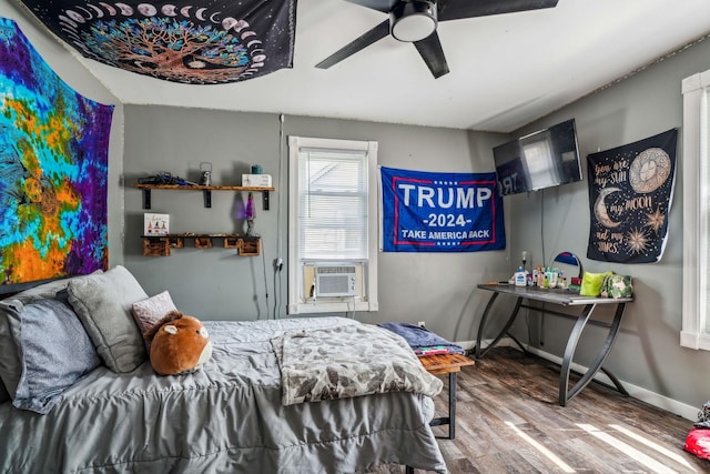 bedroom featuring hardwood / wood-style flooring and ceiling fan