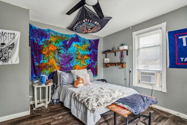 bedroom featuring ceiling fan, cooling unit, and dark wood-type flooring