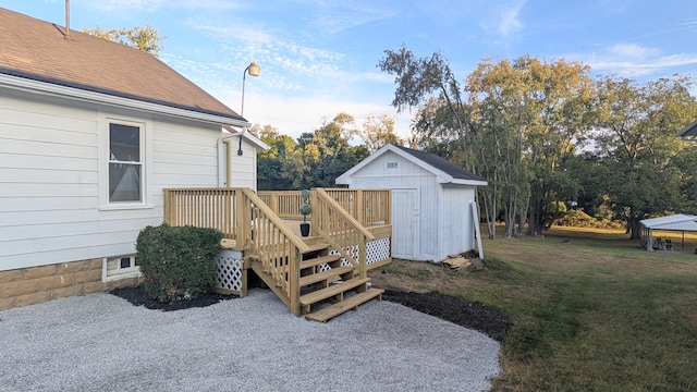 view of yard featuring a wooden deck and a shed