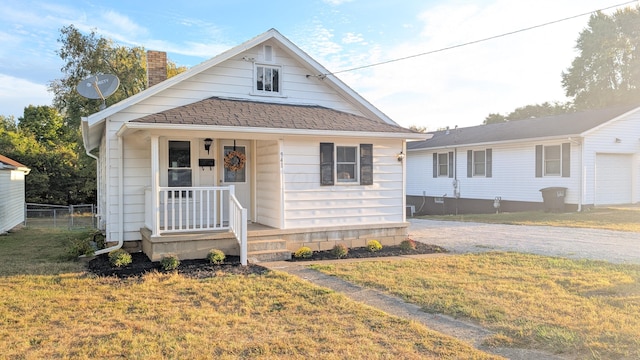 bungalow-style house with a front lawn