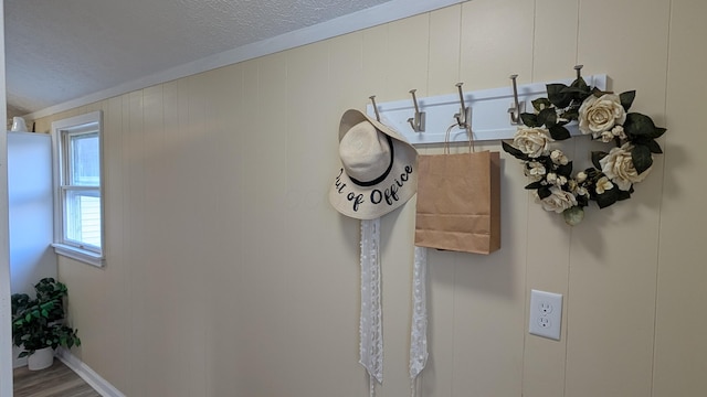 room details featuring a textured ceiling and hardwood / wood-style flooring