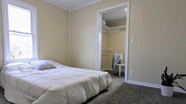 bedroom with dark carpet and a closet