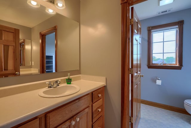 bathroom with vanity and toilet