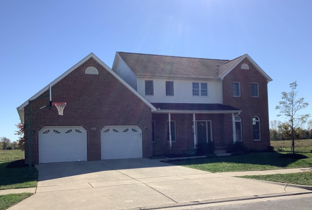 view of front facade with a garage and a front lawn