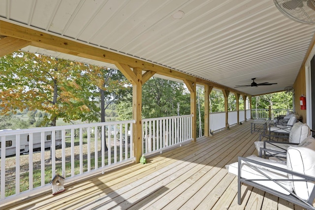 wooden terrace featuring ceiling fan