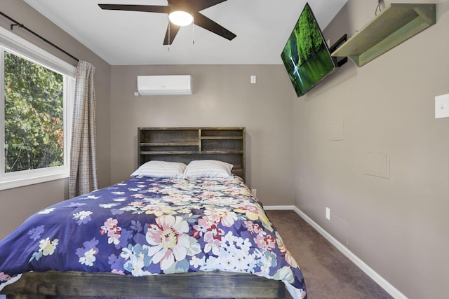 carpeted bedroom with ceiling fan and a wall mounted air conditioner