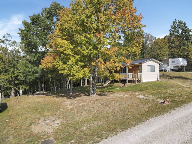 view of yard with covered porch