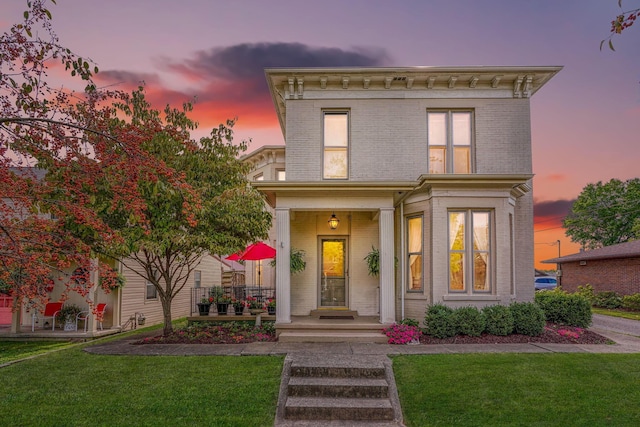 italianate-style house with a yard