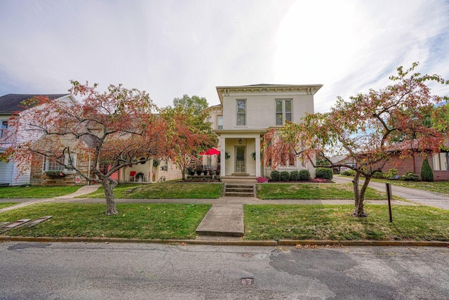 italianate-style house with a front lawn