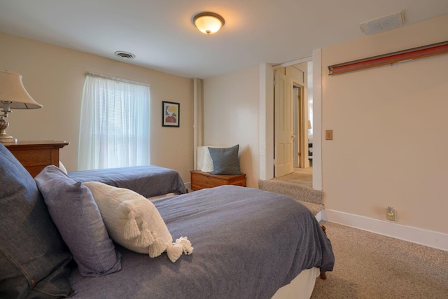 bedroom with light colored carpet