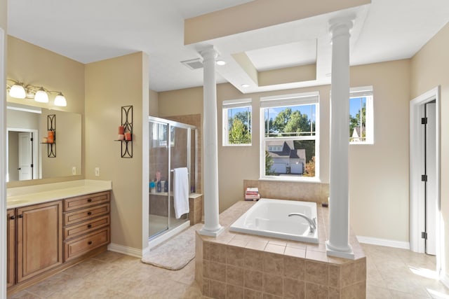 bathroom with tile patterned flooring, separate shower and tub, and ornate columns