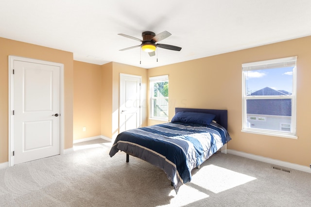 bedroom featuring ceiling fan and light colored carpet