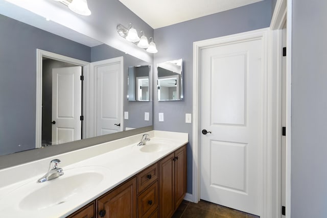 bathroom featuring tile patterned flooring and vanity