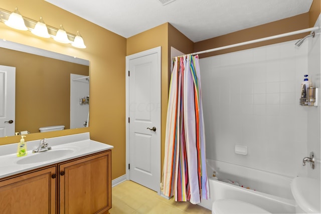 full bathroom featuring a textured ceiling, vanity, toilet, and shower / bath combo