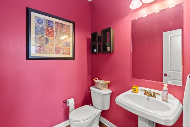 bathroom with toilet and sink