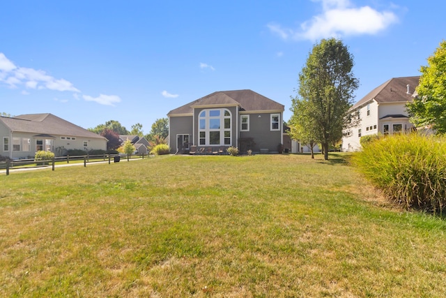 back of house featuring a yard