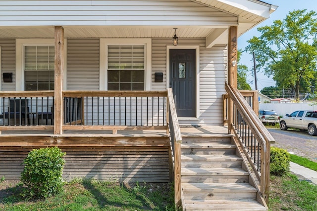 doorway to property with a porch