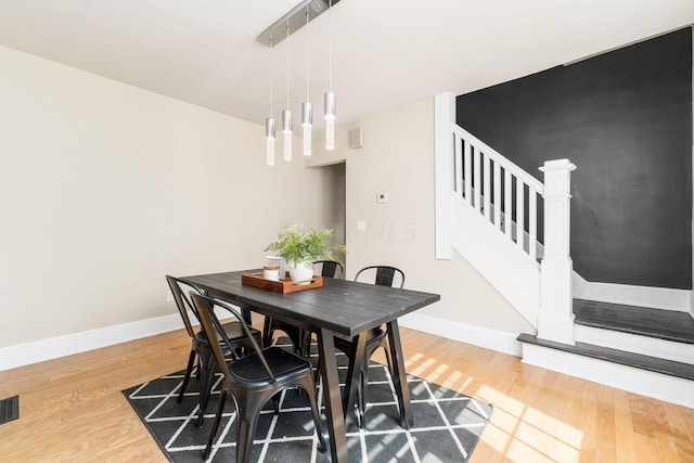 dining room with hardwood / wood-style floors