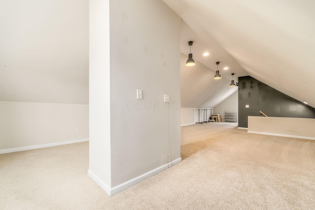 bonus room with lofted ceiling and carpet floors