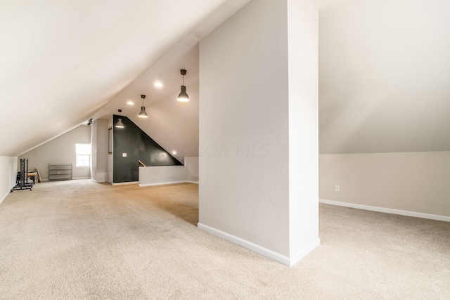 bonus room with carpet flooring and lofted ceiling