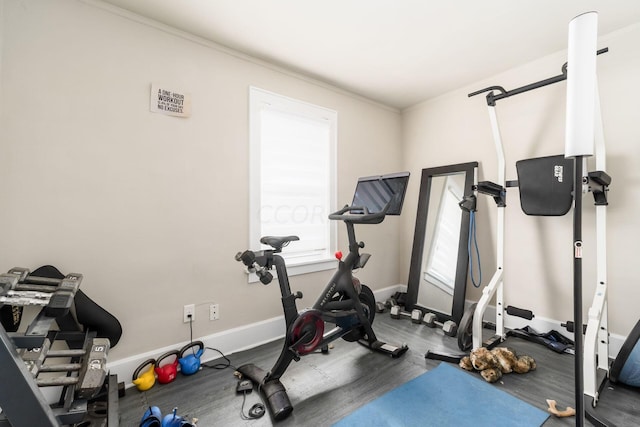 workout area featuring ornamental molding