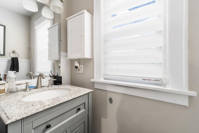 bathroom featuring vanity and a healthy amount of sunlight