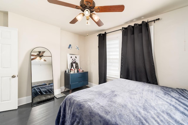 bedroom featuring dark hardwood / wood-style flooring and ceiling fan