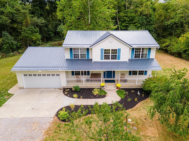 view of front of house featuring covered porch and a garage