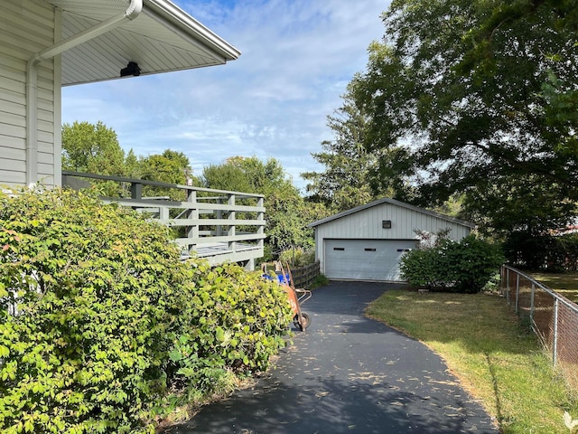 exterior space with an outbuilding and a garage