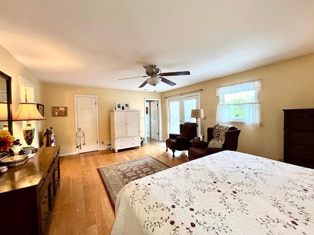 bedroom featuring light wood-type flooring and ceiling fan