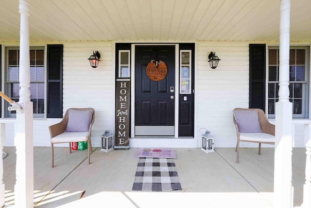 view of exterior entry featuring a porch