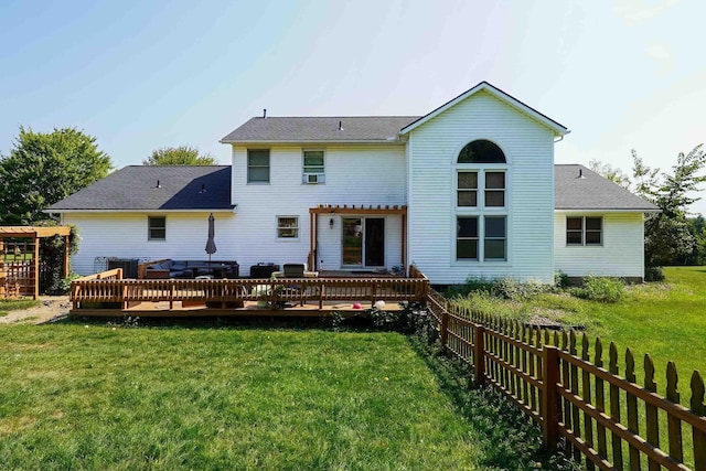 rear view of house featuring a pergola, a yard, and a deck