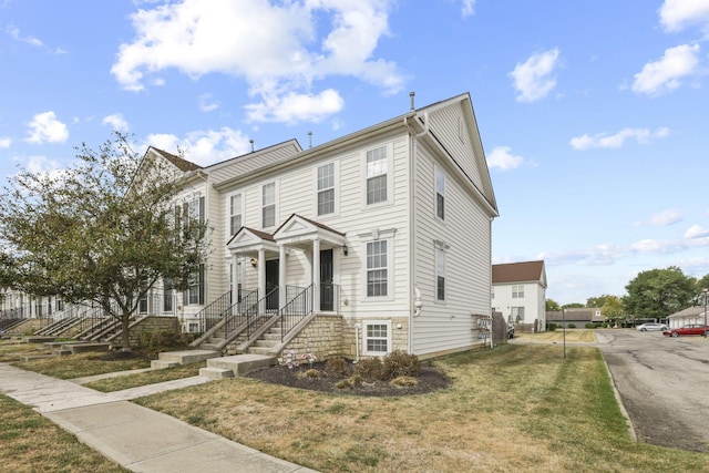 view of front facade with a front yard