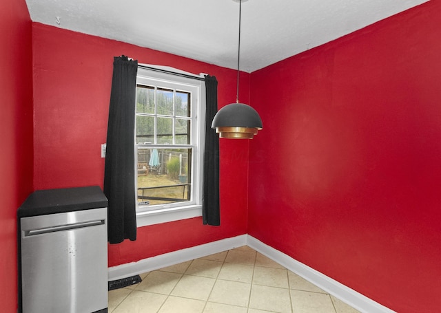 unfurnished dining area with tile patterned floors