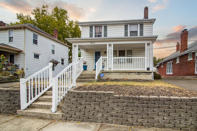 view of front of property featuring covered porch