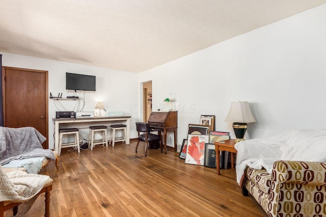 living area with hardwood / wood-style floors