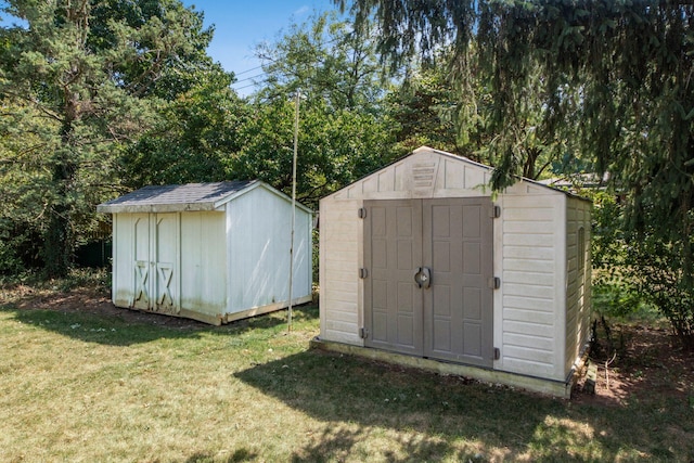 view of outbuilding with a lawn