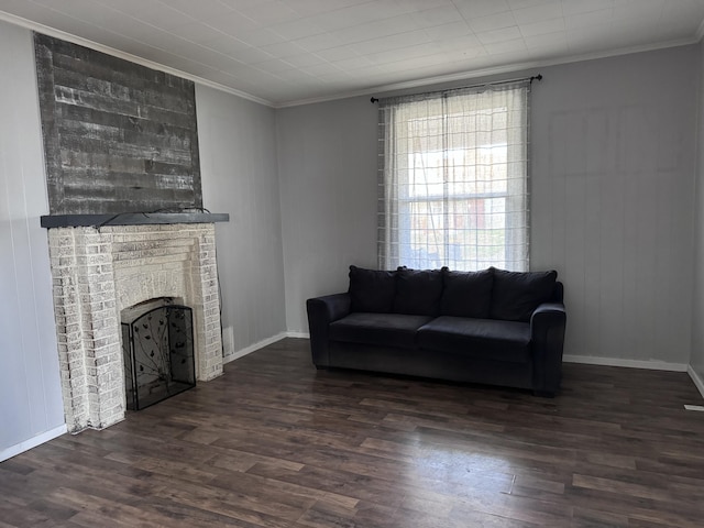 living room with a fireplace, dark wood-type flooring, and ornamental molding