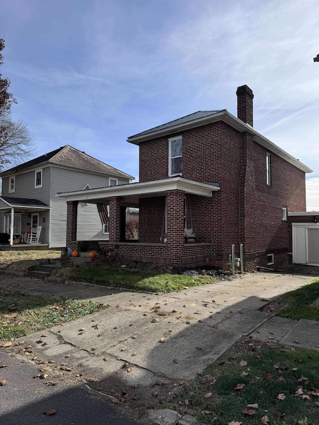 rear view of house with a porch