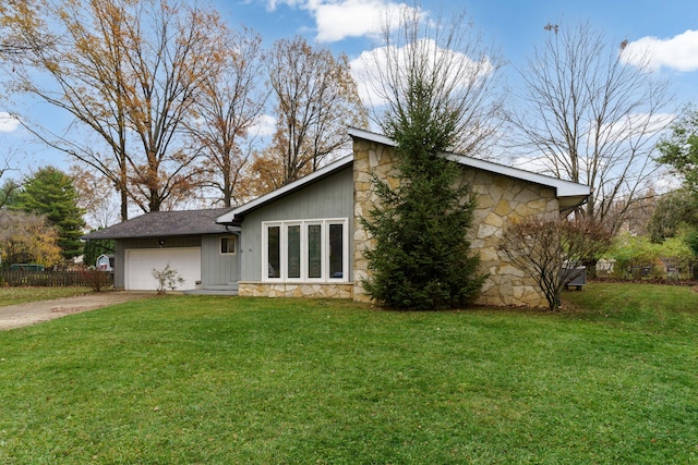 exterior space featuring a yard and a garage