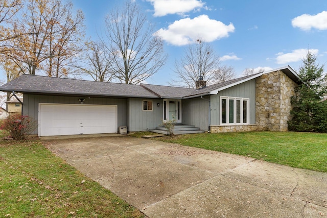 ranch-style house with a front yard and a garage