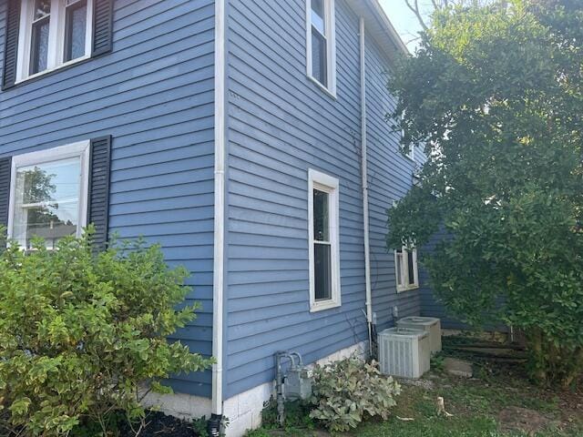 view of home's exterior featuring cooling unit