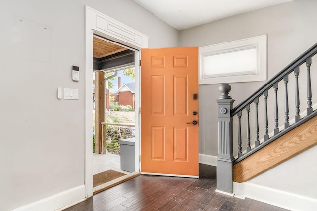 entrance foyer with dark hardwood / wood-style floors