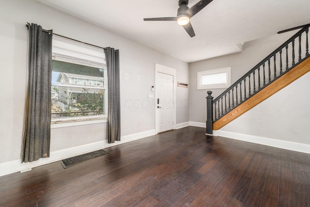 foyer entrance featuring dark hardwood / wood-style floors and ceiling fan