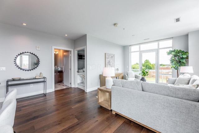 living room with dark hardwood / wood-style flooring