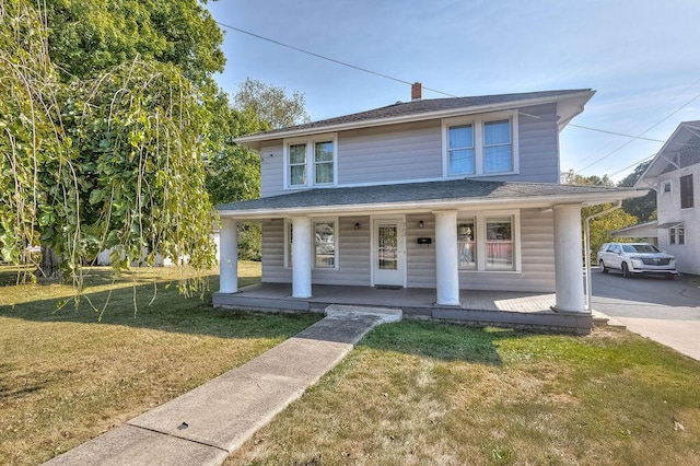 702 Coshocton Ave, Mount Vernon, OH 43050 - view of front of home featuring a porch and a front lawn