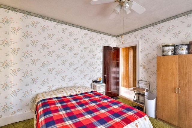 702 Coshocton Ave, Mount Vernon, OH 43050 - carpeted bedroom with wallpapered walls and a ceiling fan
