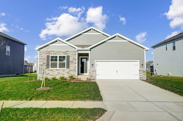 craftsman inspired home featuring a front yard and a garage