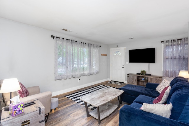 3611 Gerbert Rd, Columbus, OH 43224 - living room featuring baseboards and wood finished floors