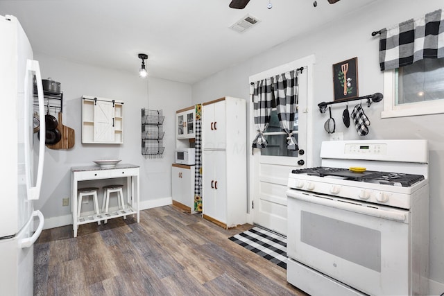 3611 Gerbert Rd, Columbus, OH 43224 - kitchen with white appliances, wood finished floors, baseboards, and a ceiling fan